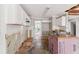 Open kitchen featuring white cabinetry and subway tile backsplash at 4467 Boatmans Cv, Stone Mountain, GA 30083