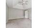 Main bedroom featuring a tray ceiling and ceiling fan at 4467 Boatmans Cv, Stone Mountain, GA 30083