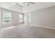 Large main bedroom featuring a tray ceiling and carpet flooring at 4467 Boatmans Cv, Stone Mountain, GA 30083