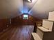 A quaint attic space with hardwood floors and a dormer window at 1712 Clifton Se Way, Atlanta, GA 30316