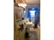 Vintage bathroom featuring a pedestal sink, blue tiling, and classic fixtures at 1712 Clifton Se Way, Atlanta, GA 30316
