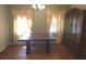 Formal dining room with a large wood table, hardwood floors, and detailed accents at 1712 Clifton Se Way, Atlanta, GA 30316