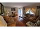 Inviting living room featuring hardwood floors, ample natural light, and classic decor at 1712 Clifton Se Way, Atlanta, GA 30316