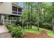 Expansive yard features a stream, firepit, lounge chairs, and multi-level deck and screened porch at 2200 Major Loring Sw Way, Marietta, GA 30064