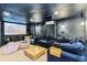 Basement featuring a projector, a large screen, dark wall paint, comfortable seating, and ample space for entertainment at 2200 Major Loring Sw Way, Marietta, GA 30064