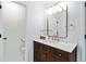 Elegant bathroom featuring a dark wood vanity with white countertop and modern fixtures at 2200 Major Loring Sw Way, Marietta, GA 30064