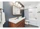 Modern bathroom featuring a wooden vanity, sleek mirror, and tiled shower at 2200 Major Loring Sw Way, Marietta, GA 30064