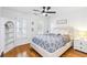 Bright bedroom with white walls, hardwood floors, and a ceiling fan at 2200 Major Loring Sw Way, Marietta, GA 30064