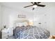 Bedroom with white walls, light-colored bedding, and a ceiling fan at 2200 Major Loring Sw Way, Marietta, GA 30064