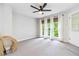 Bonus room featuring neutral walls, carpeted floors, modern ceiling fan, and a doorway to the outside at 2200 Major Loring Sw Way, Marietta, GA 30064