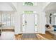 Bright foyer with hardwood floors, white trim, and natural light streaming through the front door at 2200 Major Loring Sw Way, Marietta, GA 30064