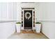 Charming front entrance with a wreath, potted plants, and a welcoming doormat at 2200 Major Loring Sw Way, Marietta, GA 30064