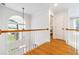 Bright hallway features hardwood floors, elegant lighting, and a large arched window providing natural light at 2200 Major Loring Sw Way, Marietta, GA 30064