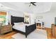 Charming bedroom with decorative bed, fireplace, and natural light at 2200 Major Loring Sw Way, Marietta, GA 30064