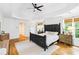 Bright and airy main bedroom with decorative bed and hardwood floors at 2200 Major Loring Sw Way, Marietta, GA 30064