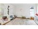 Spacious playroom features lots of natural light, light hard wood floors, neutral colored rug and white walls at 2200 Major Loring Sw Way, Marietta, GA 30064