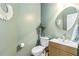 Stylish powder room featuring modern fixtures, a unique mirror, and elegant decor at 2200 Major Loring Sw Way, Marietta, GA 30064