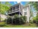 The home's backyard includes a multi-level deck and screened porch nestled within a private wooded setting at 2200 Major Loring Sw Way, Marietta, GA 30064