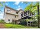 Exterior view of the home showcasing a screened porch, multi-level deck, and backyard at 2200 Major Loring Sw Way, Marietta, GA 30064