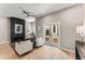 Bright and airy living room with a modern fireplace, ceiling fan, and large sliding glass doors at 1099 North Ne Ave # 13, Atlanta, GA 30307