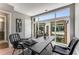 Office with large windows offering neighborhood views, contemporary furniture, and modern design elements for a productive workspace at 1099 North Ne Ave # 13, Atlanta, GA 30307