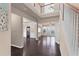 Bright, spacious foyer with hardwood floors, stairs to upper level, and views into adjacent rooms at 1212 Lake Point Way, Suwanee, GA 30024