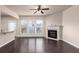 Bright living room with a fireplace, breakfast bar, and abundant natural light at 1212 Lake Point Way, Suwanee, GA 30024