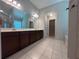 Bathroom featuring double sinks with tile floors and a walk-in shower at 239 Lenore Ct, Hiram, GA 30141