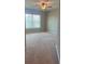 Bedroom featuring carpet flooring and a large window at 239 Lenore Ct, Hiram, GA 30141