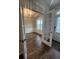 Bright dining room features dark wood floors and a modern chandelier, perfect for entertaining at 239 Lenore Ct, Hiram, GA 30141