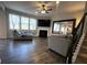 Bright living room with hardwood floors, fireplace, large windows and a large decorative mirror at 239 Lenore Ct, Hiram, GA 30141