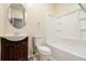 Cozy bathroom featuring a shower-tub combination with built-in shelves, single sink, and tile floors at 734 Celeste Sw Ln # 84, Atlanta, GA 30331
