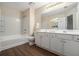 Clean bathroom features a shower/tub combo, white vanity, and contemporary fixtures at 734 Celeste Sw Ln # 84, Atlanta, GA 30331