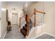 Inviting entryway with hardwood floors, staircase with wooden handrail and neutral color palette at 734 Celeste Sw Ln # 84, Atlanta, GA 30331