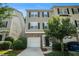 Charming townhome with brick accents, attached garage, manicured landscaping, and inviting front entrance at 734 Celeste Sw Ln # 84, Atlanta, GA 30331