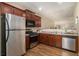 Well-equipped kitchen featuring stainless steel appliances, wooden cabinets, and tile backsplash at 734 Celeste Sw Ln # 84, Atlanta, GA 30331