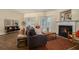 Inviting living room featuring fireplace, hardwood floors, and modern furniture at 734 Celeste Sw Ln # 84, Atlanta, GA 30331