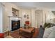 Comfortable living room featuring a fireplace, hardwood floors, and modern furniture at 734 Celeste Sw Ln # 84, Atlanta, GA 30331