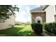 View of back yard and side exterior of home, with stone accents at 11854 Registry Blvd, Hampton, GA 30228