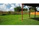 Spacious backyard with a full lawn, wooden fence, and the partial view of a deck providing a great outdoor space at 11854 Registry Blvd, Hampton, GA 30228