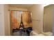 Bathroom featuring a unique Eiffel Tower-themed shower curtain and ample space at 11854 Registry Blvd, Hampton, GA 30228