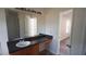 Neutral bathroom featuring a vanity mirror with granite countertops at 11854 Registry Blvd, Hampton, GA 30228