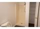 This bathroom features a shower, toilet, wood-look flooring, and a closet with shelving for optimal storage at 11854 Registry Blvd, Hampton, GA 30228