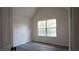 Bright bedroom with new laminate flooring and a view of the front yard through the large window at 11854 Registry Blvd, Hampton, GA 30228