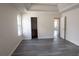 Spacious bedroom with gray wood floors, natural lighting, and walk-in closet at 11854 Registry Blvd, Hampton, GA 30228