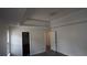 Well lit bedroom with large windows and gray flooring at 11854 Registry Blvd, Hampton, GA 30228