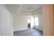An empty bedroom shows the gray floors and high ceilings at 11854 Registry Blvd, Hampton, GA 30228