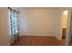 Bedroom with new laminate flooring and closet view of the en-suite bathroom at 11854 Registry Blvd, Hampton, GA 30228
