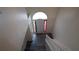 Foyer with a light colored door and laminate floors at 11854 Registry Blvd, Hampton, GA 30228