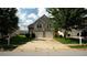 Charming two-story home featuring a two-car garage and well-maintained front yard at 11854 Registry Blvd, Hampton, GA 30228